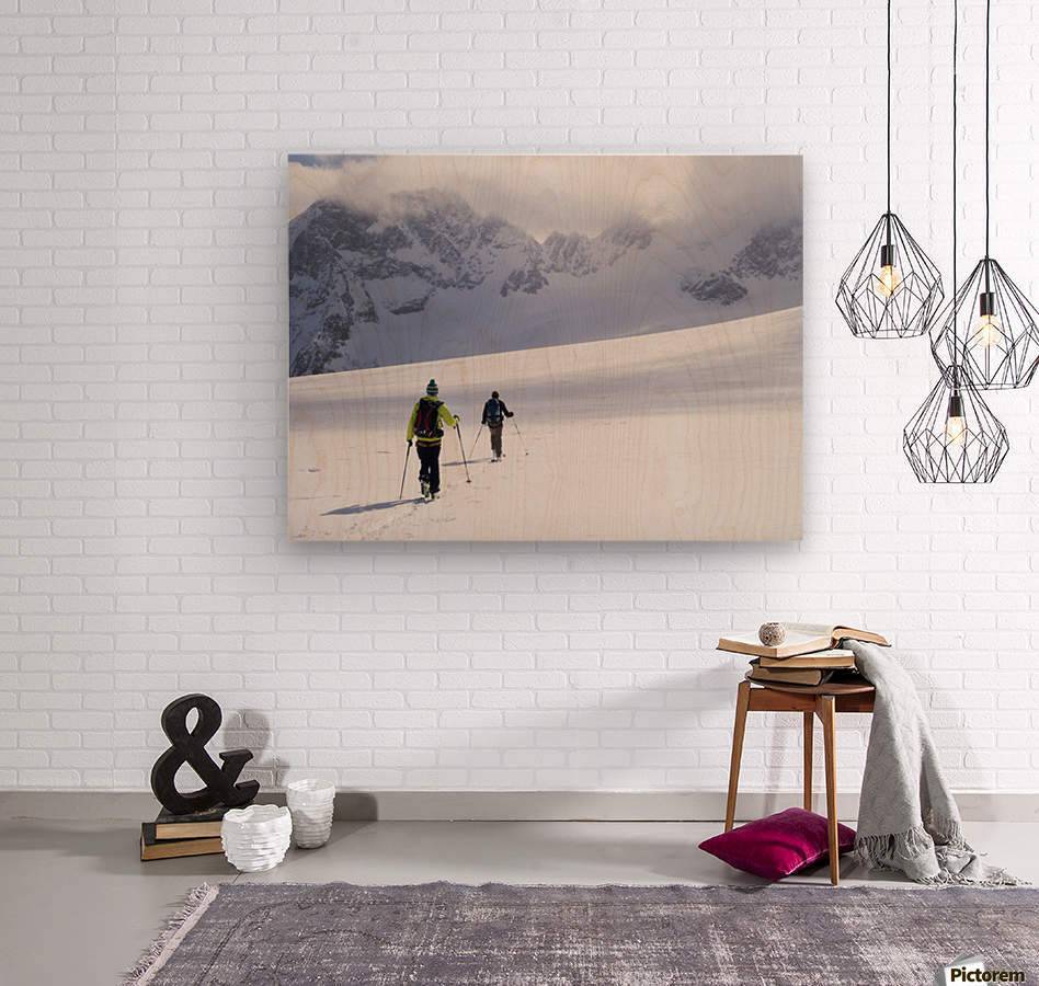 Two skiers ski touring across the Ottemma glacier - Powderaddicts