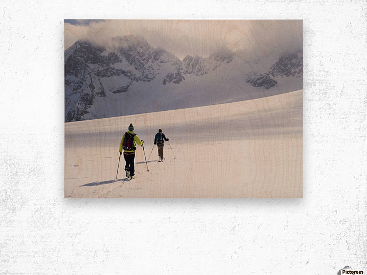 Two skiers ski touring across the Ottemma glacier - Powderaddicts