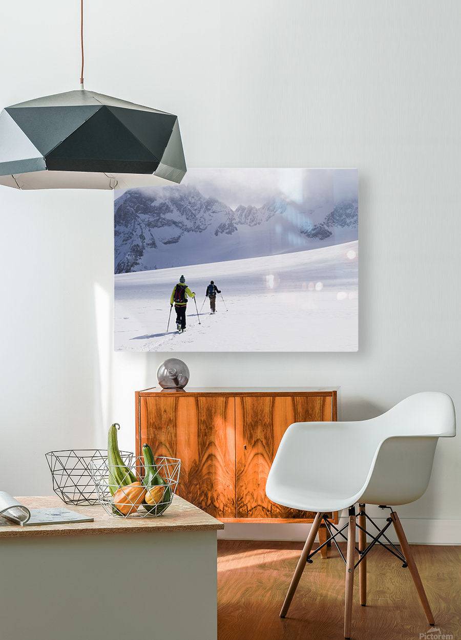 Two skiers ski touring across the Ottemma glacier - Powderaddicts