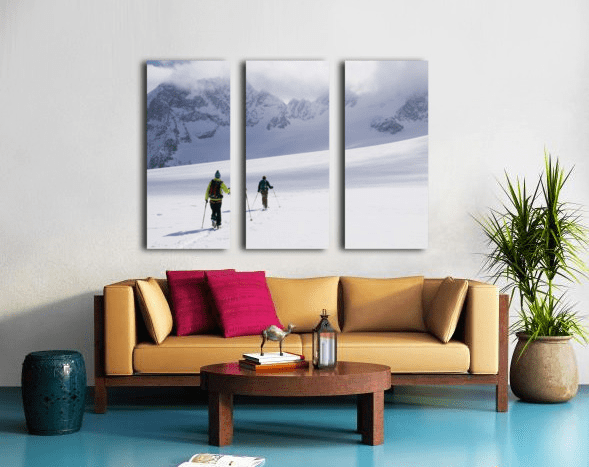 Two skiers ski touring across the Ottemma glacier - Powderaddicts