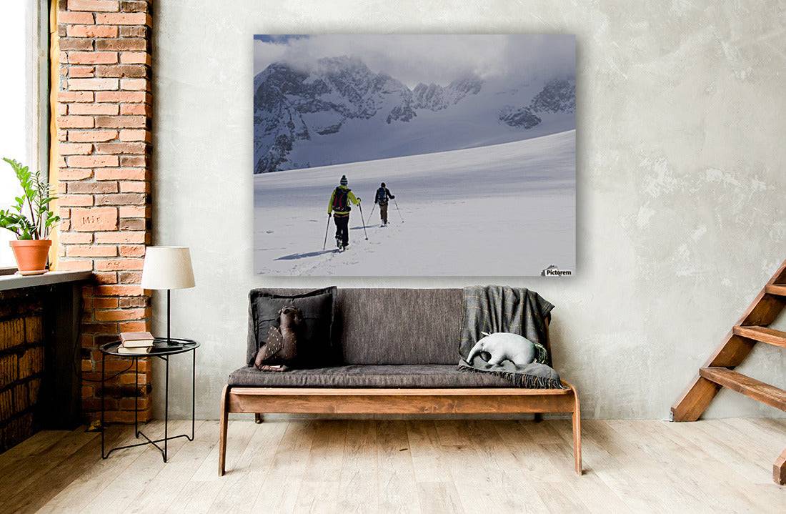 Two skiers ski touring across the Ottemma glacier - Powderaddicts